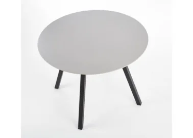 Minimalistinio dizaino šviesiai pilkos spalvos apvalus valgomojo stalas Balrog su juodomis metalinėmis kojelėmis.