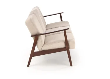Trijų vietų sofa su tvirtu mediniu rėmu ir kreminės spalvos pagalvėlėmis.Tai minimalistinio ir klasikinio stiliaus baldas, idealiai tinkantis elegantiškam ir jaukiam interjerui, siūlantis patogumą bei stabilumą.
