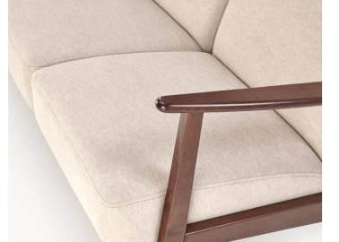 Trijų vietų sofa su tvirtu mediniu rėmu ir kreminės spalvos pagalvėlėmis.

Tai minimalistinio ir klasikinio stiliaus baldas, idealiai tinkantis elegantiškam ir jaukiam interjerui, siūlantis patogumą bei stabilumą.