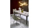Alyvuogių spalvos elegantiška išskirtinės formos valgomojo kėdė K543. Kėdė apsiūta aukštos kokybės gobelenu, o kojelės pagamintos iš milteliniu būdu dažyto plieno.