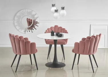 Elegantiškas apvalus valgomojo stalas Ambarsio. Stalo stalviršis pagamintas iš stiklo, dekoruoto baltos spalvos marmuro raštais, o masyvi koja pagaminta iš milteliniu būdu dažyto plieno.